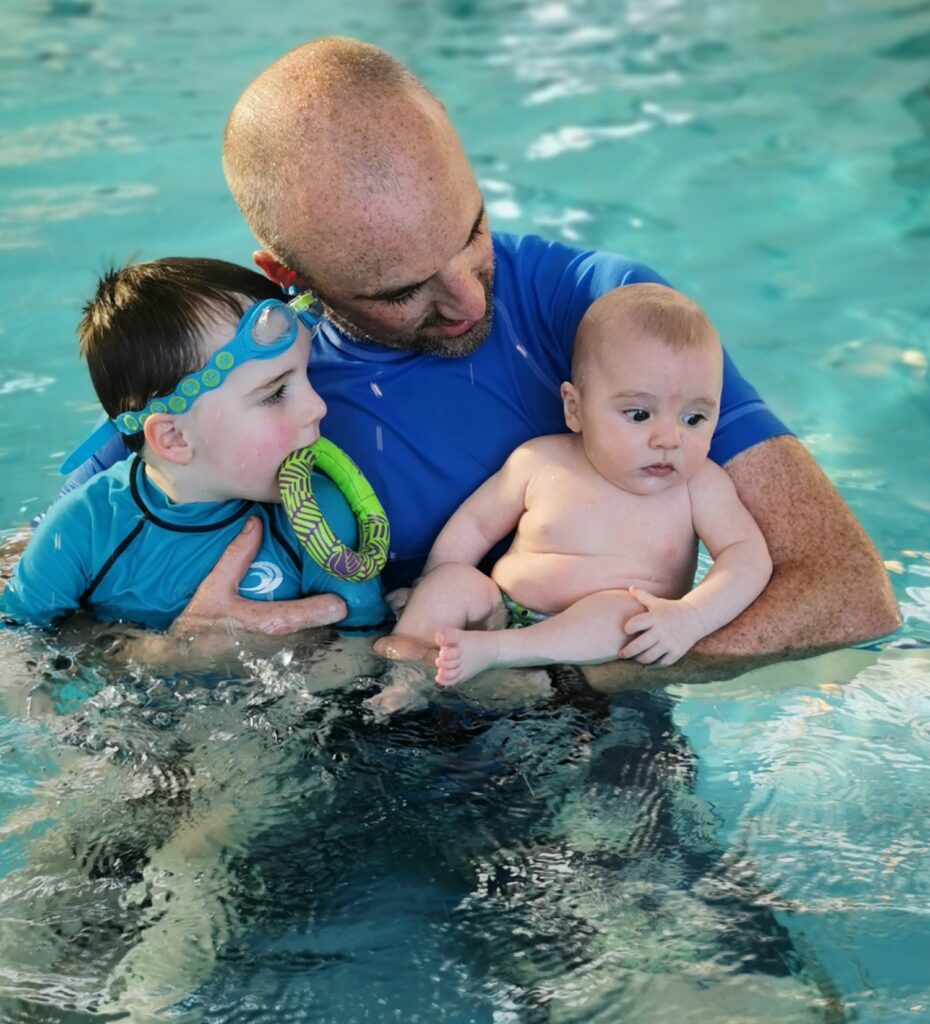 Our Story - David Bree with his boys in the pool.